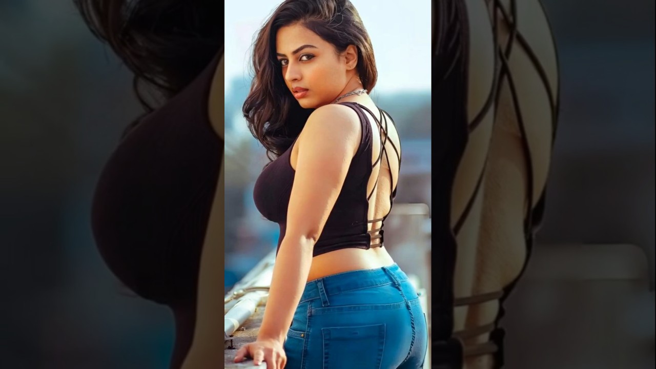 Stunning Three-Quarter Back Portrait of Indian Woman | Black Top & Blue Jeans | Desi Sarees